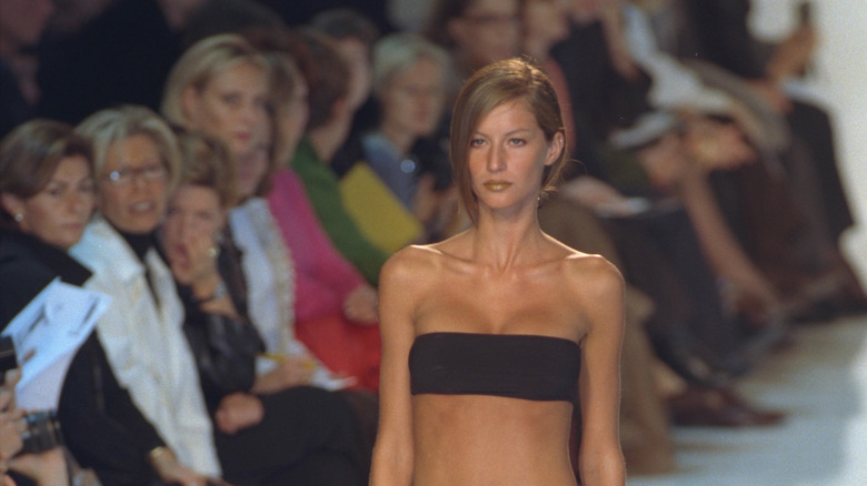 Gisele Bündchen modeling YSL swimwear in 2000