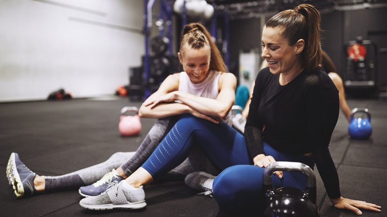 Two women sitting after workout