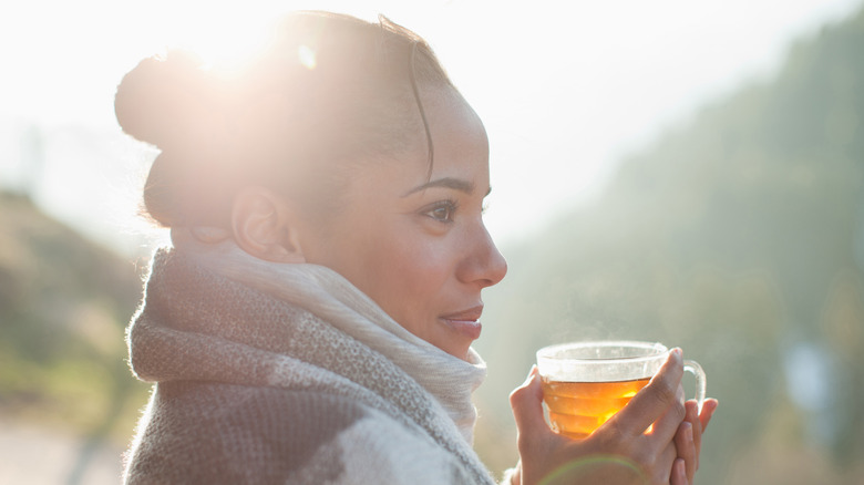 thoughtful women with beverage