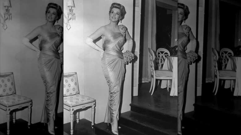 Donna Douglas in a gown in an elegant living room
