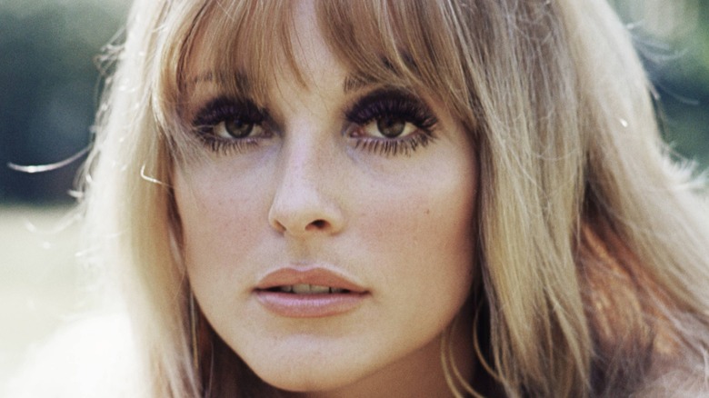 A close up of Sharon Tate's face with long lashes
