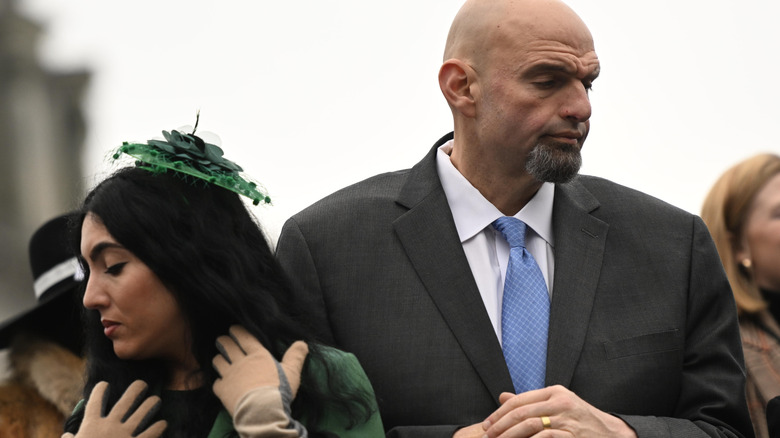 Senator John Fetterman (D-PA) and his wife, Gisele Barreto Fetterman, stand during the singing of the National Anthem before Josh Shapiro was sworn in as Governor of Pennsylvania at the State Capitol Building on January 17, 2023 in Harrisburg, Pennsylvania.