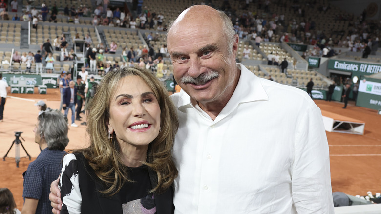 Robin and Phil McGraw on arena floor