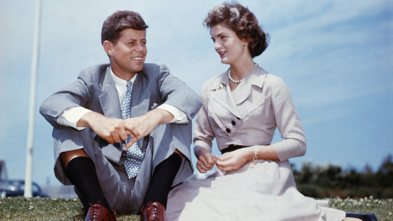 John F. Kennedy and Jacqueline Bouvier outside