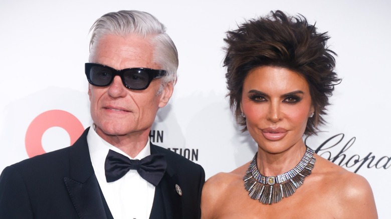Harry Hamlin and Lisa Rinna posing on a red carpet