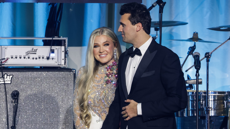 Charlie Kirk (R) and and his wife Erika Lane Frantzve (L) on stage during the Turning Point USA Inaugural-Eve Ball at the Salamander Hotel on January 19, 2025.