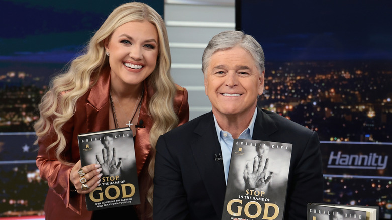 Erika Kirk and Sean Hannity with Charlie Kirk book