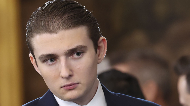 Barron Trump looking off to the side