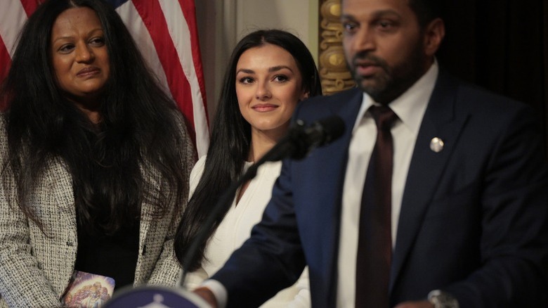 Alexis Wilkins looks on while Kash Patel speaks after his swearing in ceremony in Washington, DC (2025)