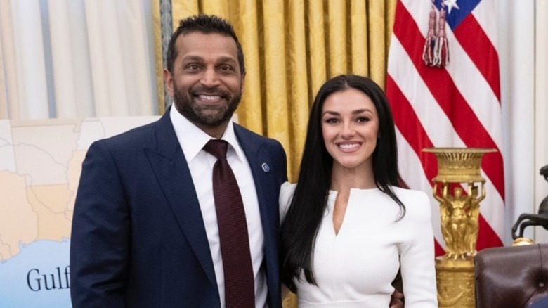 Kash Patel and Alexis Wilkins pose together in the Oval Office of the White House (2025)