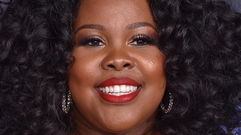 Amber Riley smiling at an event