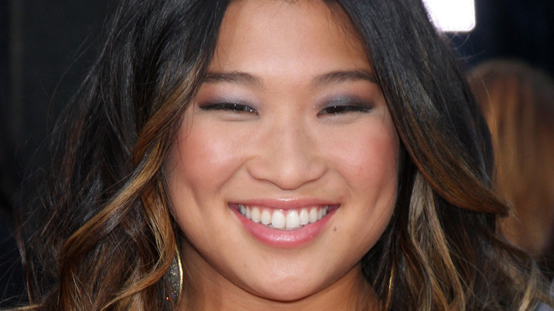 Jenna Ushkowitz smiles at an event