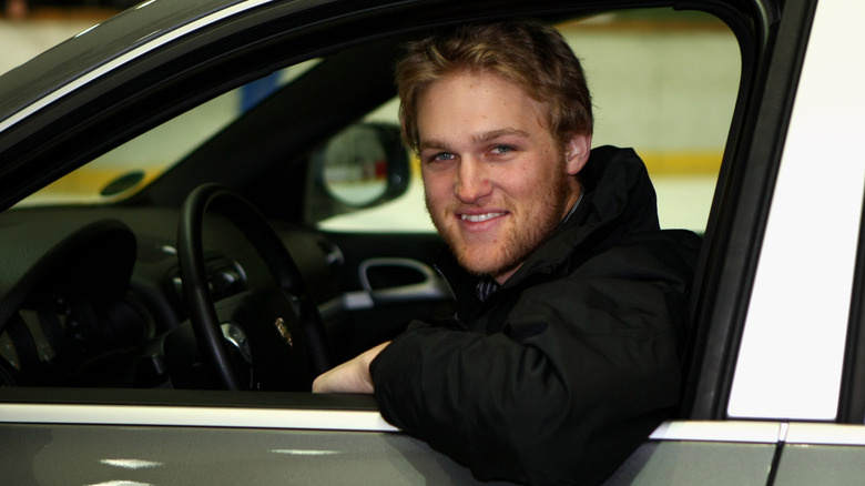 Wyatt Russell (in black) sitting in a car in 2009
