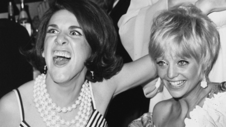 Ruth Buzzi and Goldie Hawn joking around at the Emmy Awards in 1968