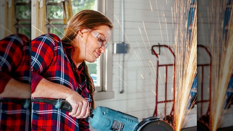 Mina Starsiak Hawk works on a home renovation project