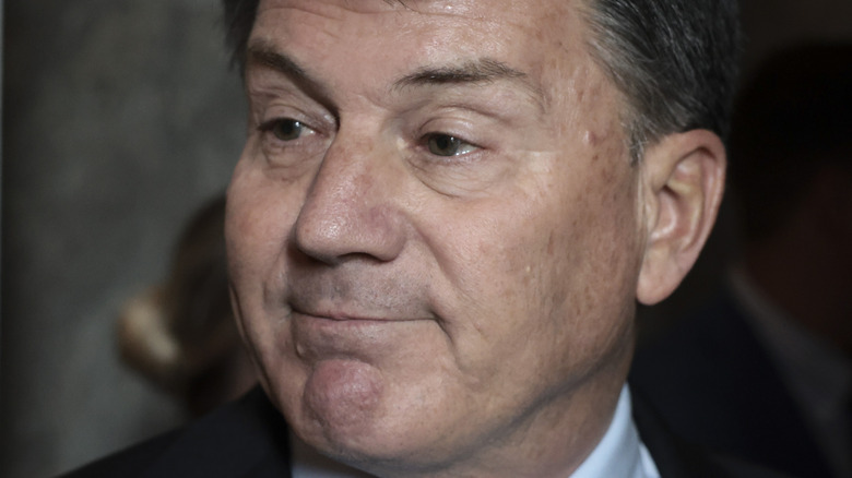 Senator Mike Rounds smiling thinly