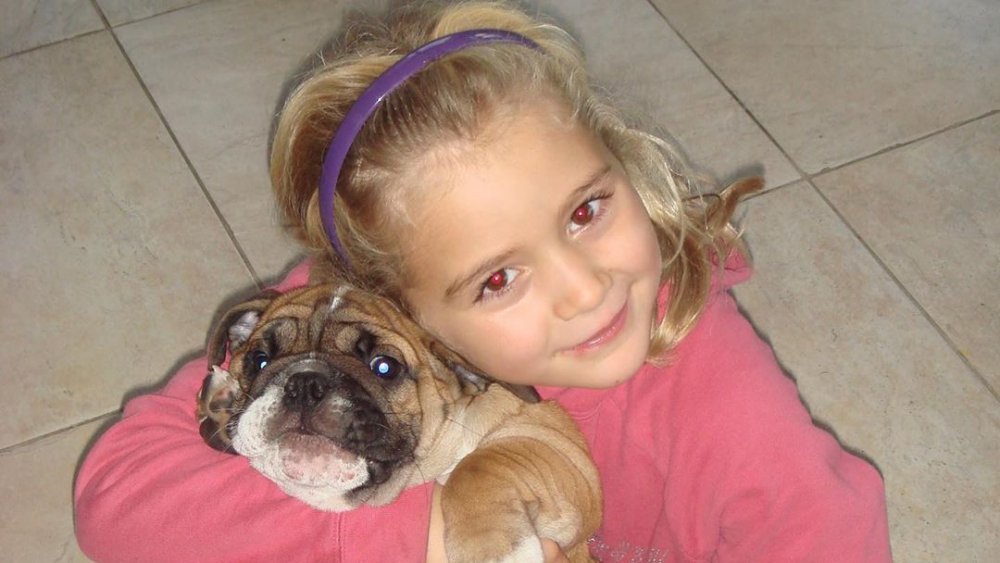 Gordon Ramsay's daughter Tilly Ramsay as a child with the family dog