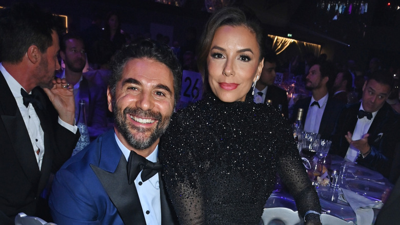 Eva Longoria sitting on José Bastón's lap