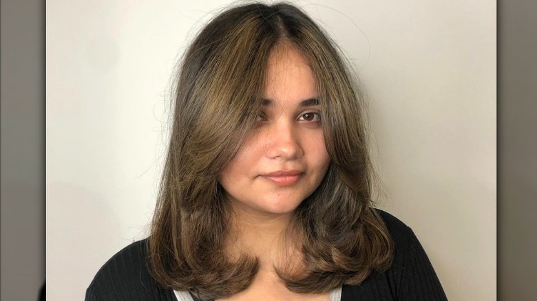 Woman with face-framing layers