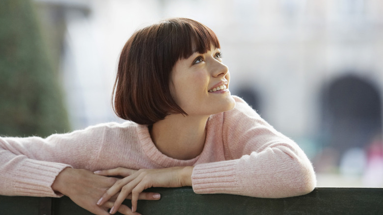 Person smiling with french bob