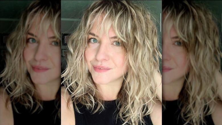 woman with blonde hair and bangs