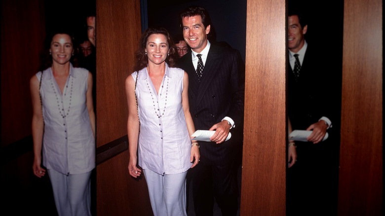 Keely Shaye Smith and Pierce Brosnan walking through a door