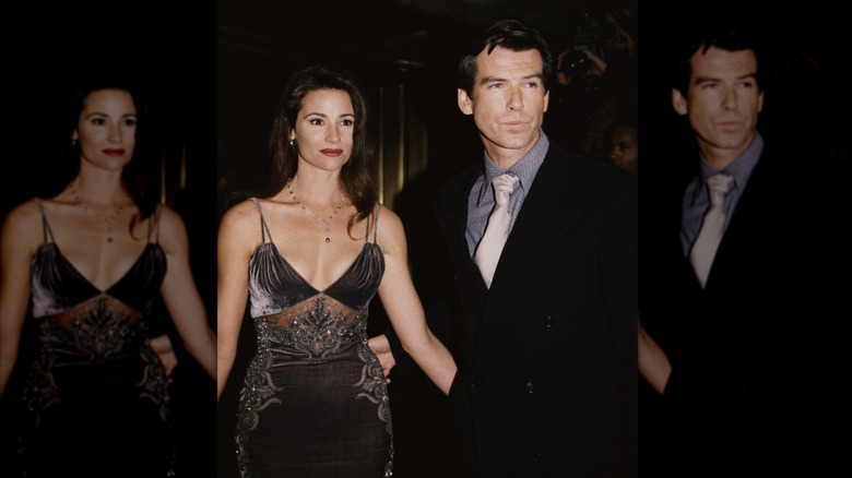 Keely Shaye Smith and Pierce Brosnan with their arms around each other