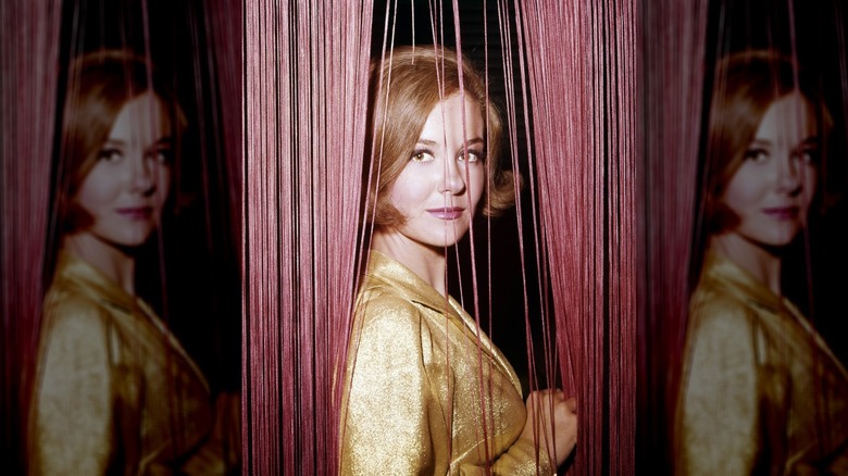 Shelley Fabares in a gold outfit staring into the camera