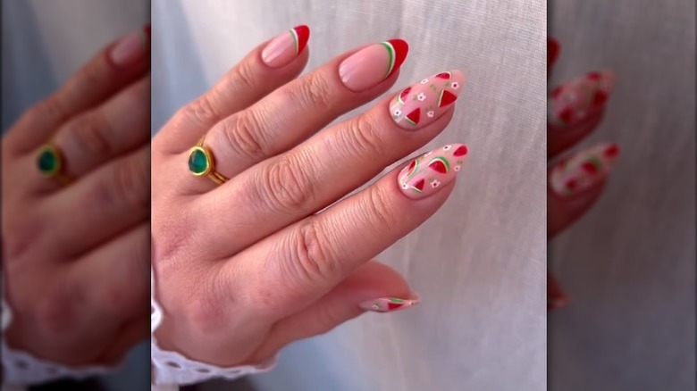 Nails painted with tiny watermelons