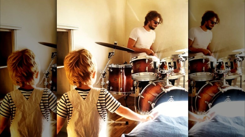 Zackary Peck playing drums and his son Atticus
