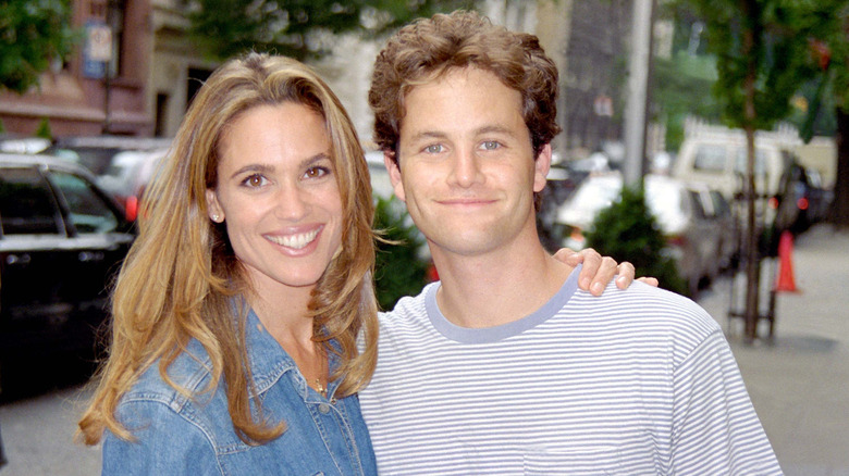 Chelsea Noble posing outdoors with her arm around Kirk Cameron.
