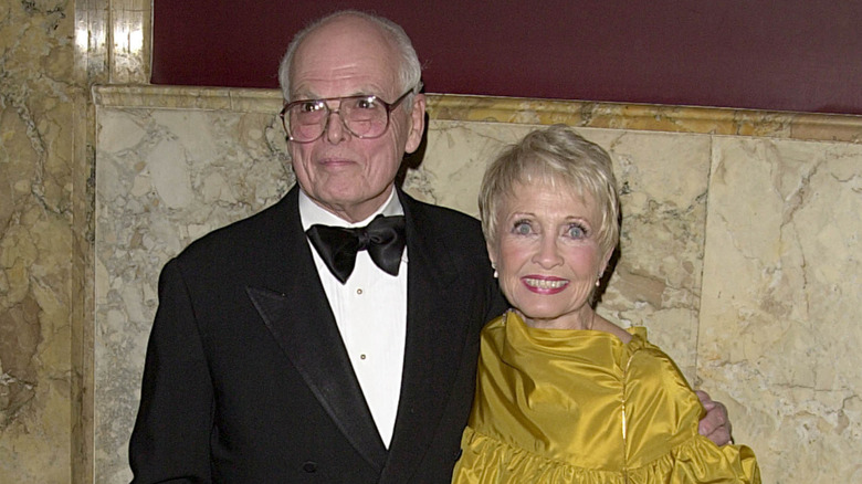 Dickie Moore wearing a tux and Jane Powell wearing a yellow dress.