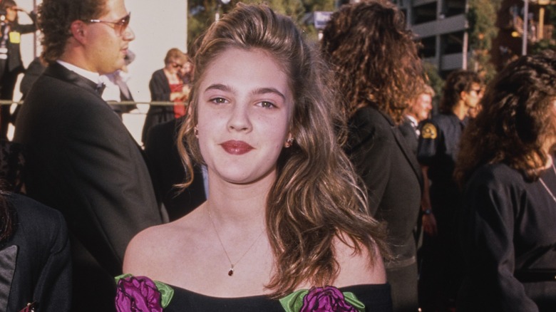 Drew Barrymore attends a red carpet event in the '80s