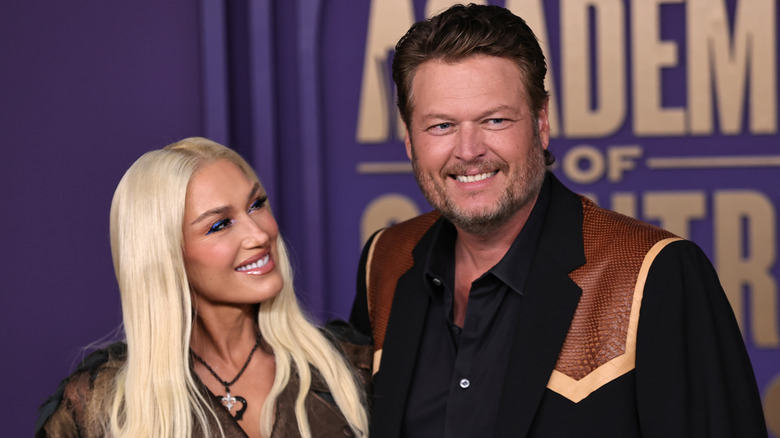 Gwen Stefani smiling at Blake Shelton