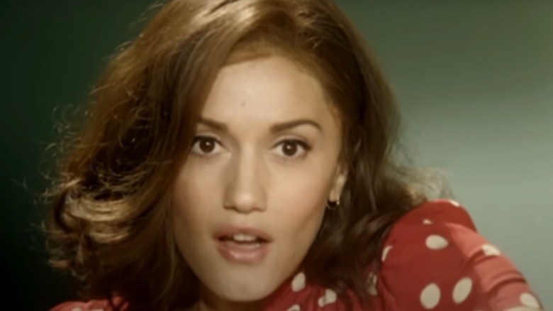 Gwen Stefani with light brown hair and red polka dot dress in "Cool" video