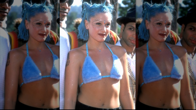 Gwen Stefani with blue hair and a blue fur bikini top