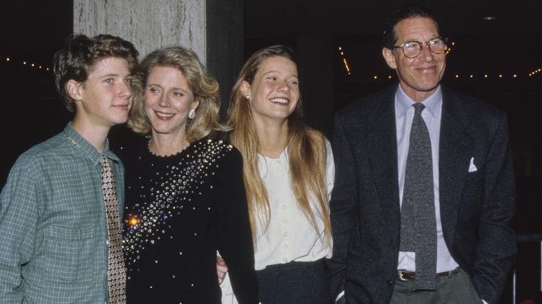 Gwyneth Paltrow smiling while attending an event with her family in 1991