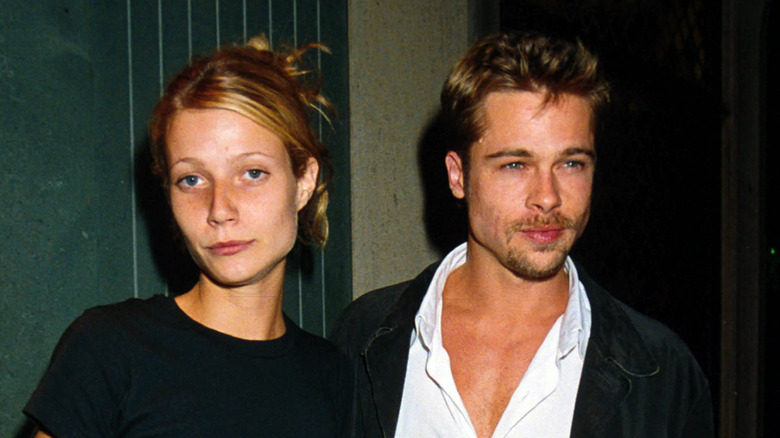 Gwyneth Paltrow posing alongside her then-boyfriend Brad Pitt