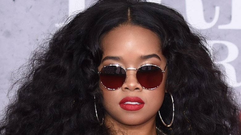 H.E.R wearing sunglasses