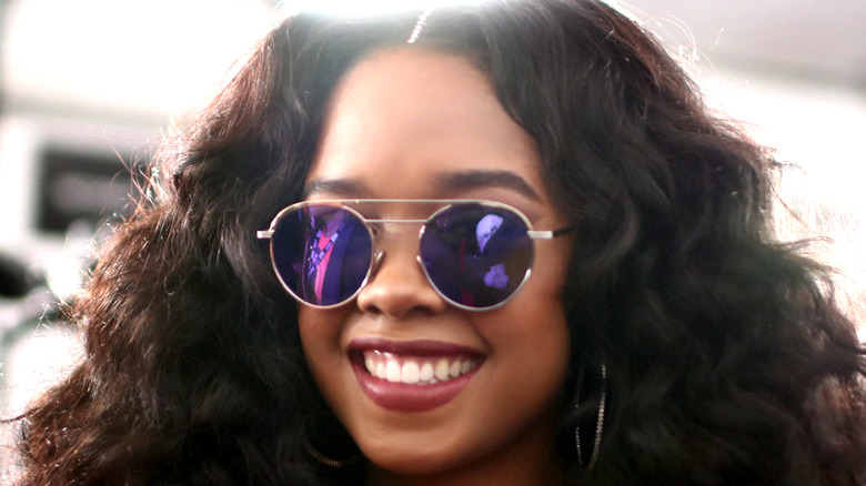 H.E.R. smiling