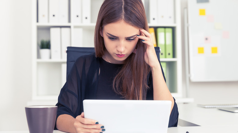 woman reading tablet
