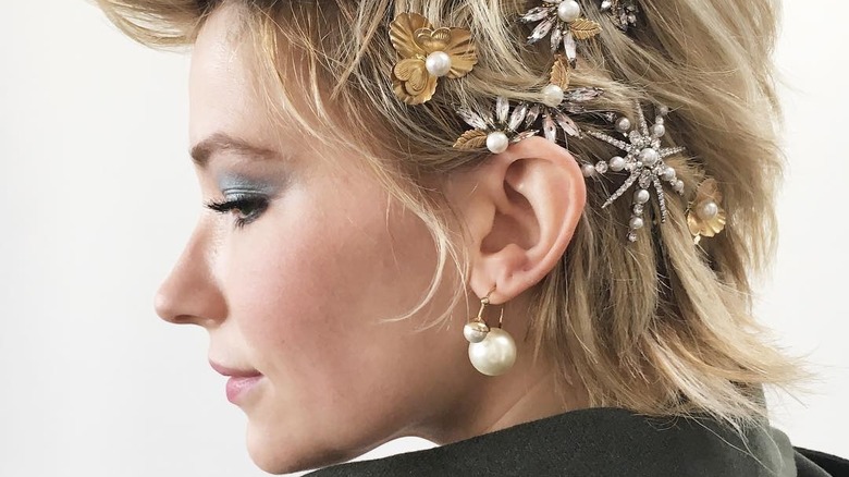 Actress Haley Bennett wearing multiple hair clips in short hair