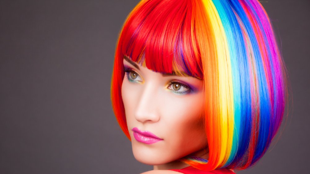 A woman with rainbow colored hair