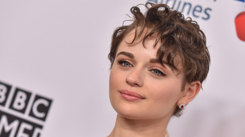 Joey King wearing a curly pixie