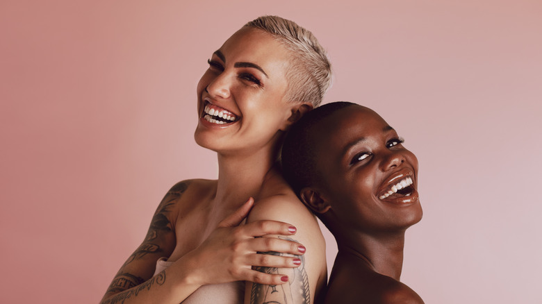 Smiling women with buzz cuts