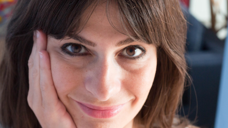 Smiling woman with bangs