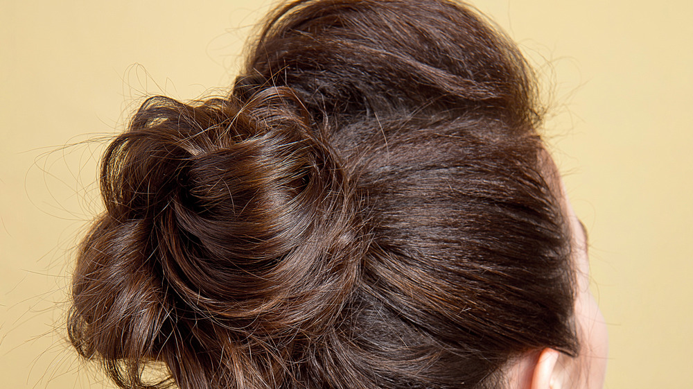 Messy bun with brown hair