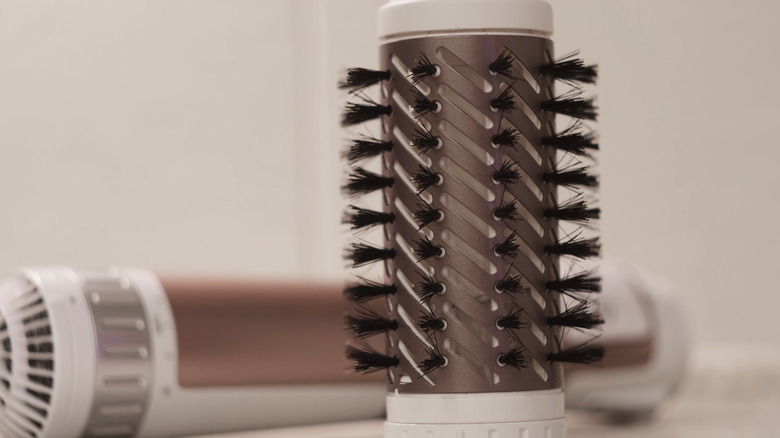 White hair-dryer brush disassembled. 