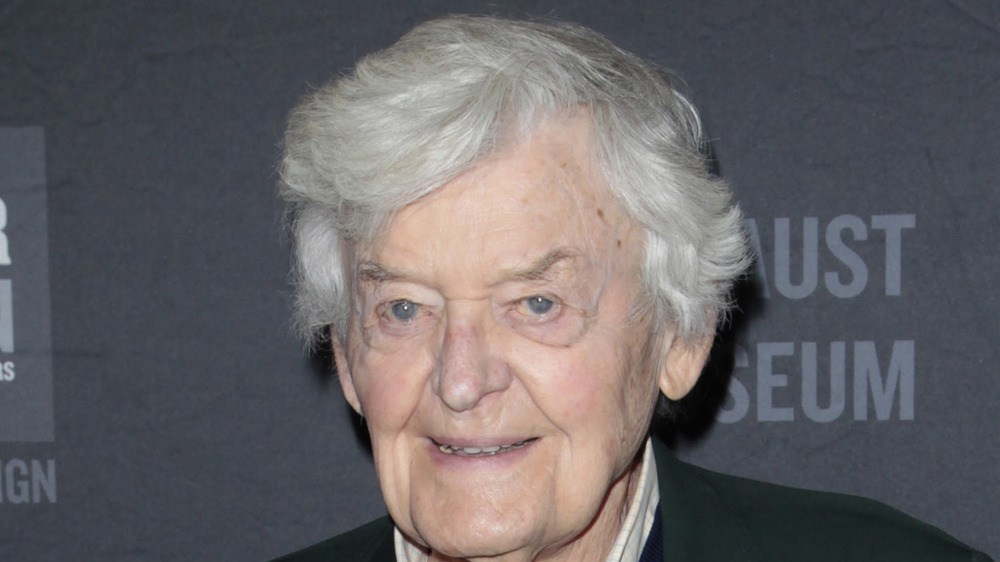 Hal Holbrook smiling in green sport coat