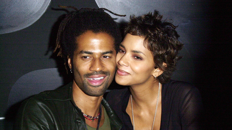 Halle Berry leaning into Eric Benét
